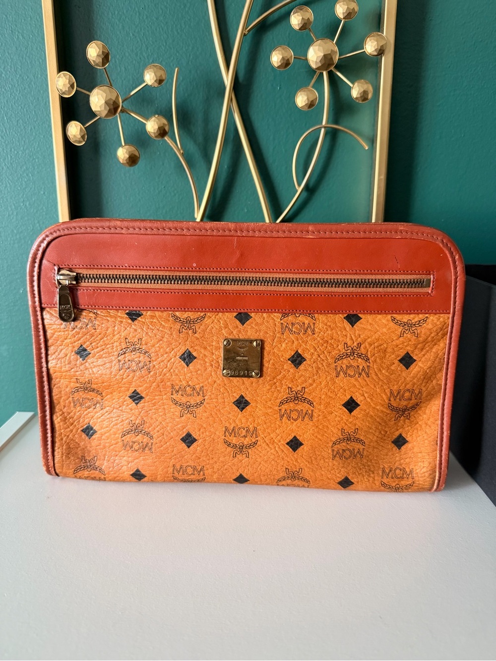 MCM Orange Logo-Print Leather Travel Clutch